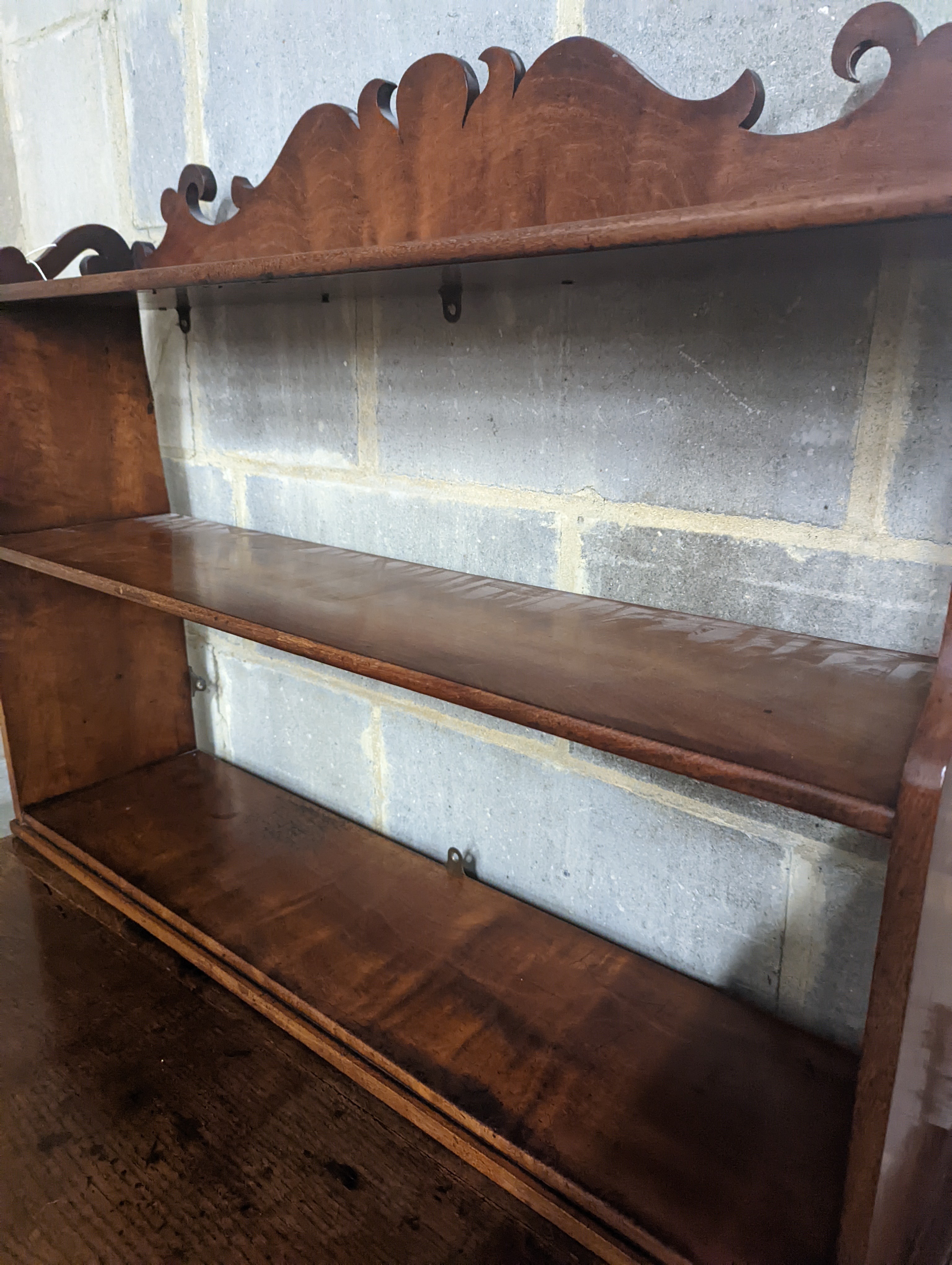 A Victorian mahogany wall bracket. W-90cm, D-22cm, H-70cm.